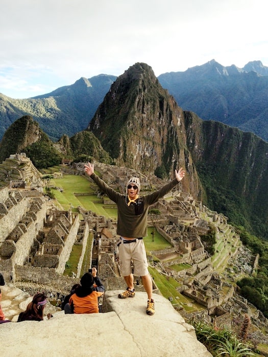 Jeff Yip, from Life Of Y, stands in front of Machu Picchu. A lost city high in the mountains of Peru