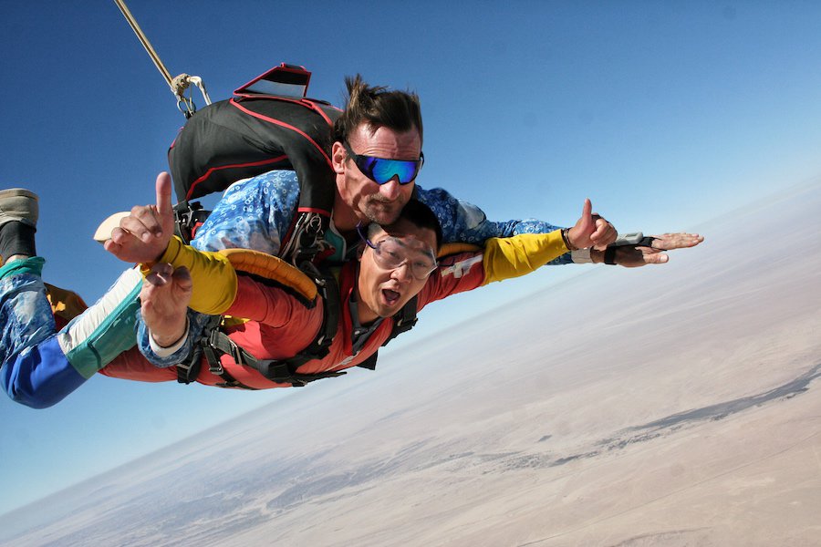 Jeff is free falling on a tandem skydive in Namibia 