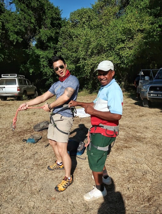 Jeff is preparing a harness with a guide at Tsingy de Bamaraha, Madagascar