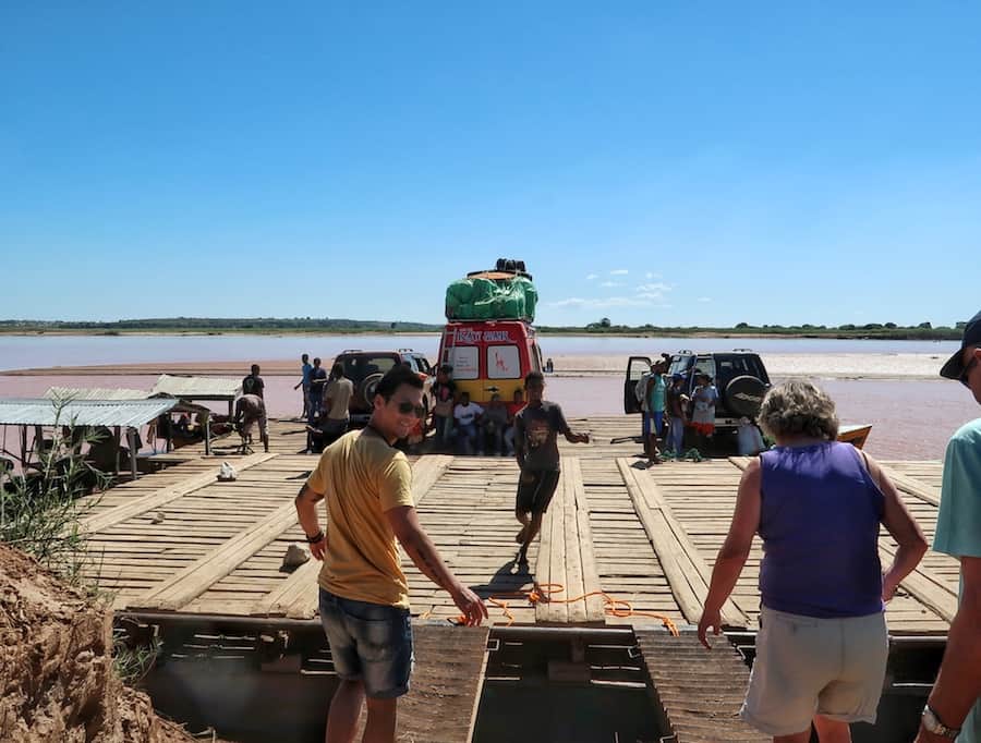 Jeff is about to board a small ferry carrying several vehicles