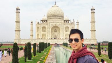 Cover photo for My Travel Bucket List post where Jeff is in front of the Taj Mahal in India