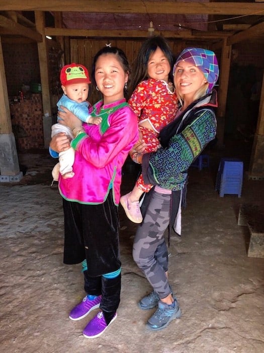 Girls dressed in traditional black Hmong clothing