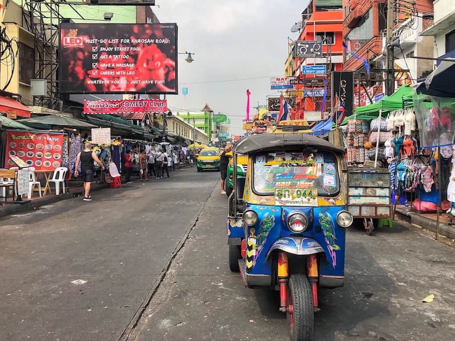 Image of Khao San Road with tuk tuk in the foreground