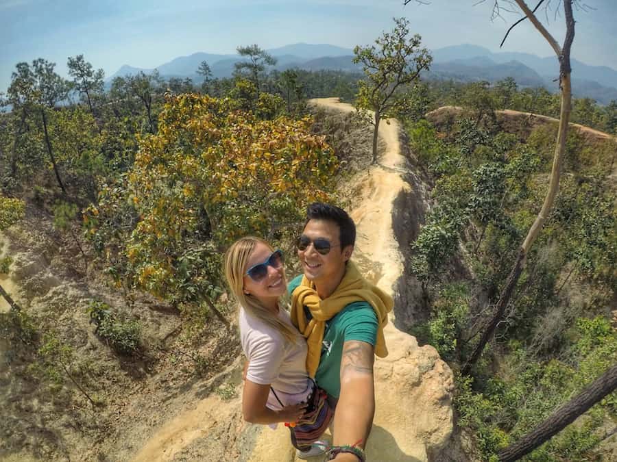 Selfie of couple standing on Pai Canyon. Last image for Thailand Travel Guide