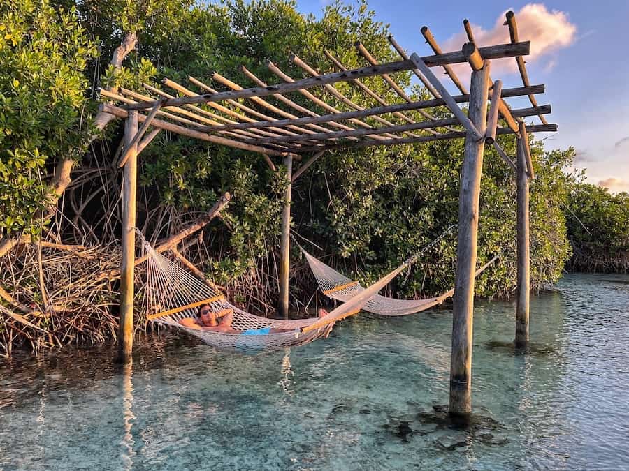 Jeff is laying in a hammock located on Flamingo Beach