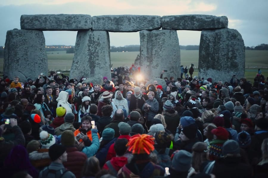 Image showing an event at Stonehenge where a crowd are amongst the stone columns