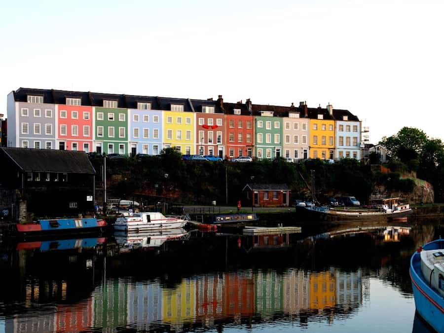 Image of the river in Bristol with colourful house up on the hillside
