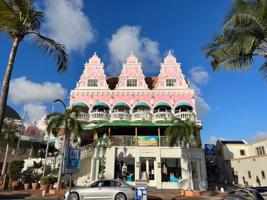 Image of a bright pink colonial building in Oranjestad, Aruba