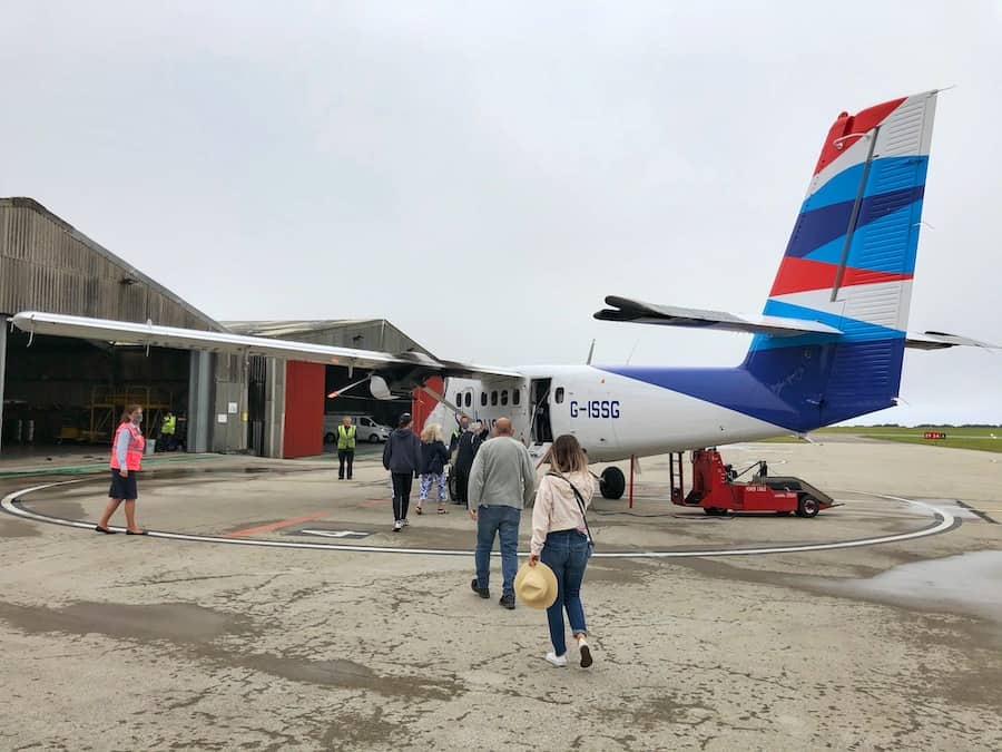 Zuzi walks towards a small propeller plane called the Sky Bus - used to transport visitors to the Isles of Scilly