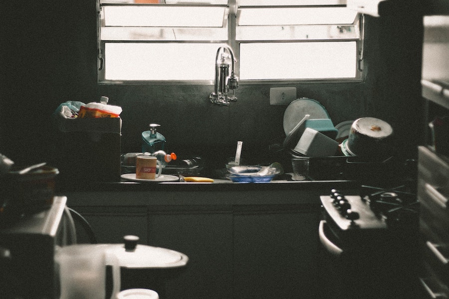 image of a kitchen sink full of dirty dishes