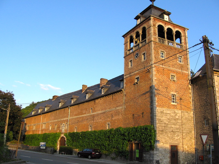 Image of the Abbaye Notre-Dame de Leffe - an old brick abbey in Dinant with the tower near the front