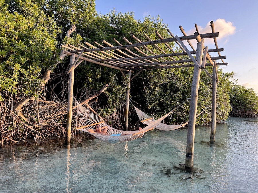 Image of Jeff relaxing in a hammock over a clear lagoon in Aruba