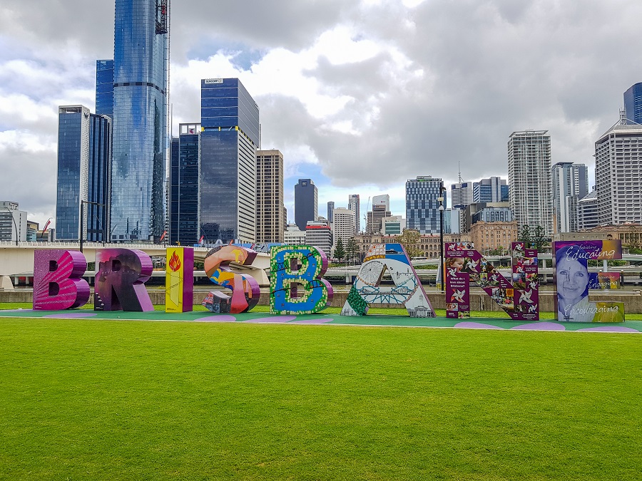 Brisbane Sign: Iconic city landmark with large bright letters against a backdrop of urban skyline.