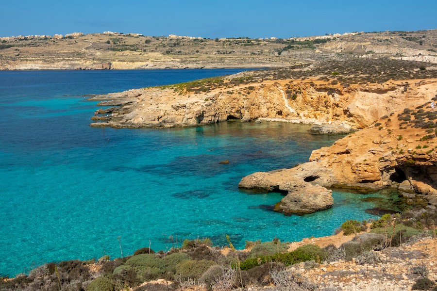 the turquoise sea with rocky cliffs in Malta