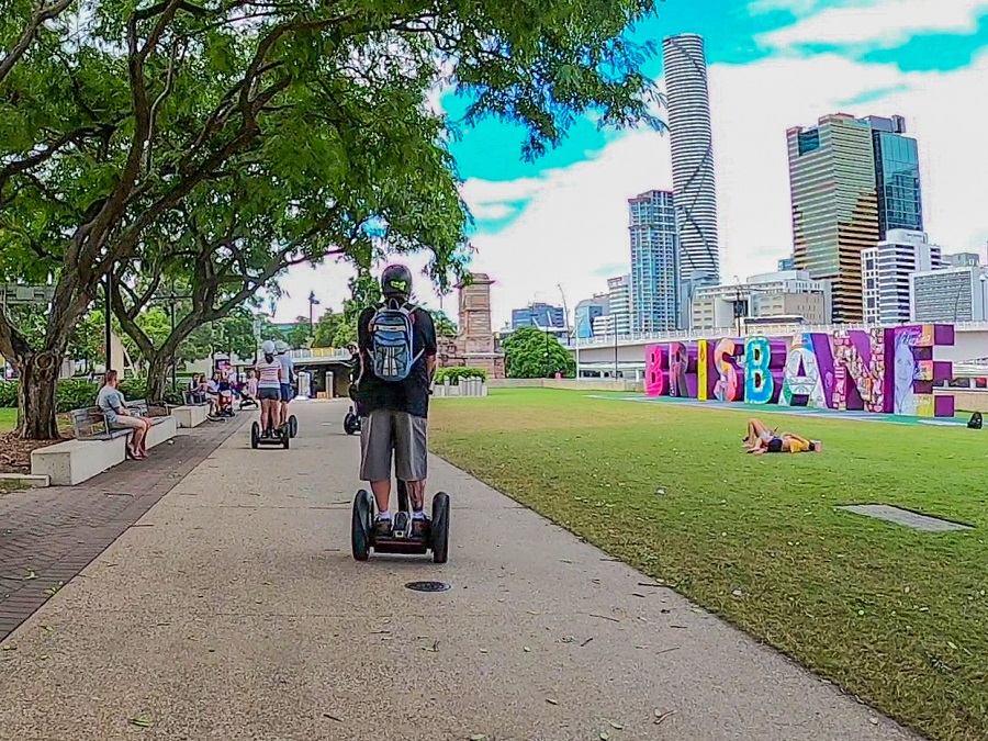 Person navigating a Segway through the city streets, enjoying a modern and efficient mode of transportation.