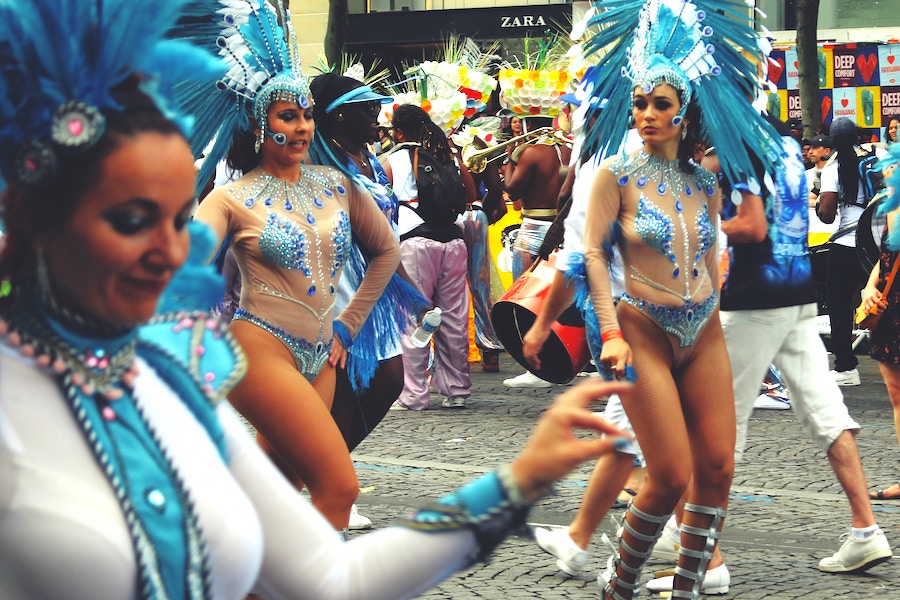 Girls dressed in extravagant blue carnival dress on the streets