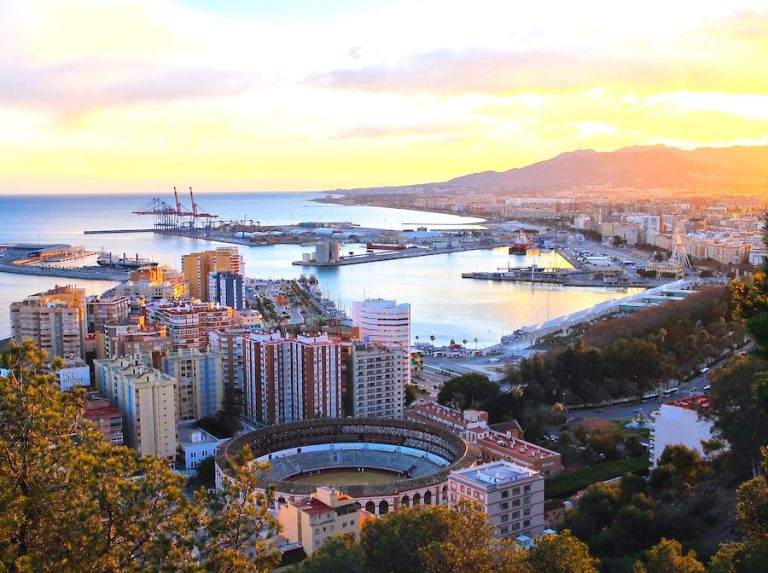 Aerial view of the city of Malaga in Winter showing a stadium and the seafront