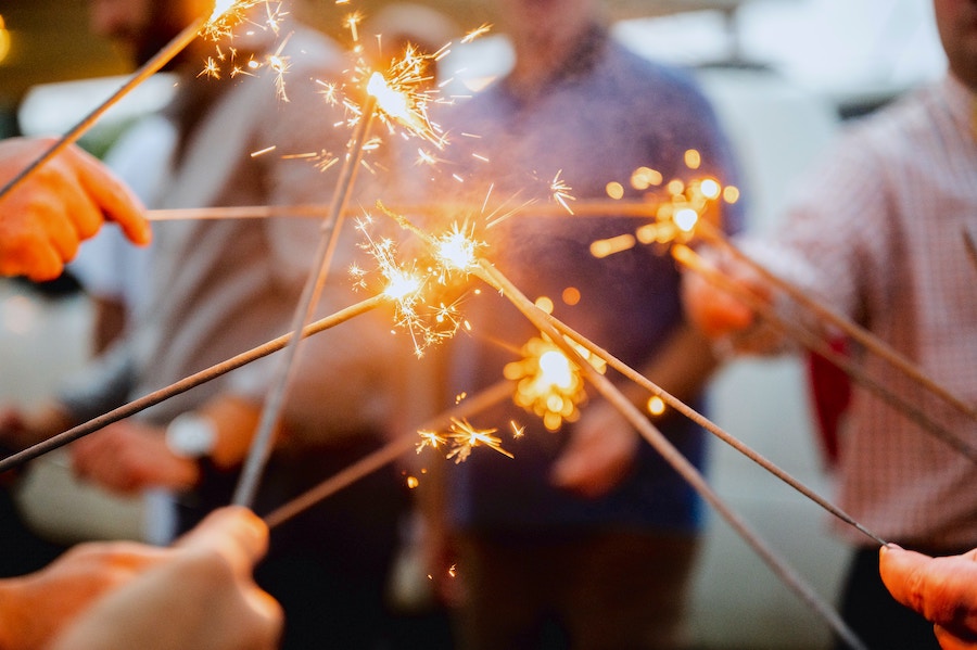 close up of many sparklers that are lit and sparkloing