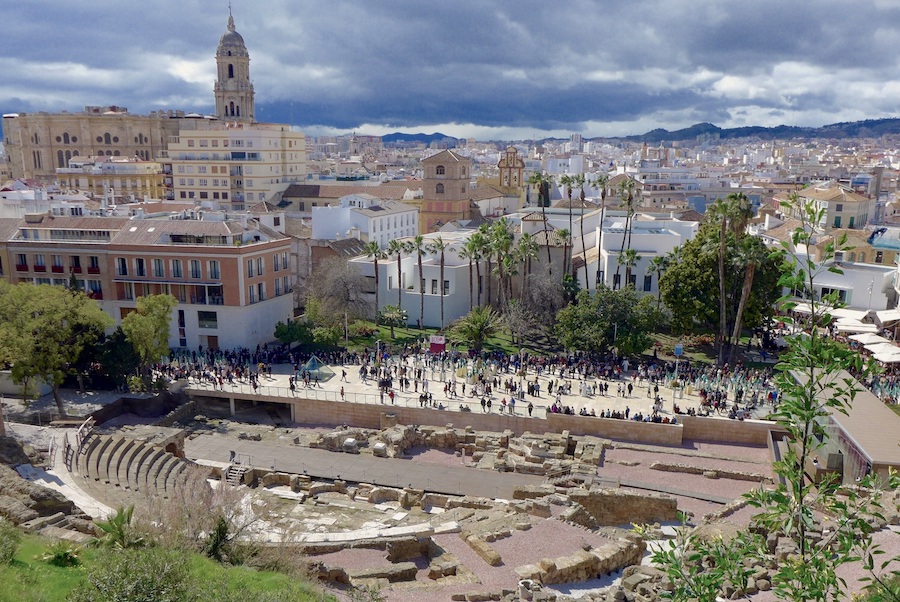 Ruins of an amphitheatre in Malaga with the city in the background