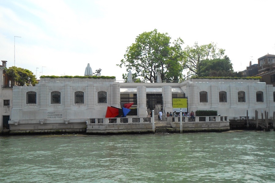 The Peggy Guggenheim Collection building entrance shown along the canal in Venice