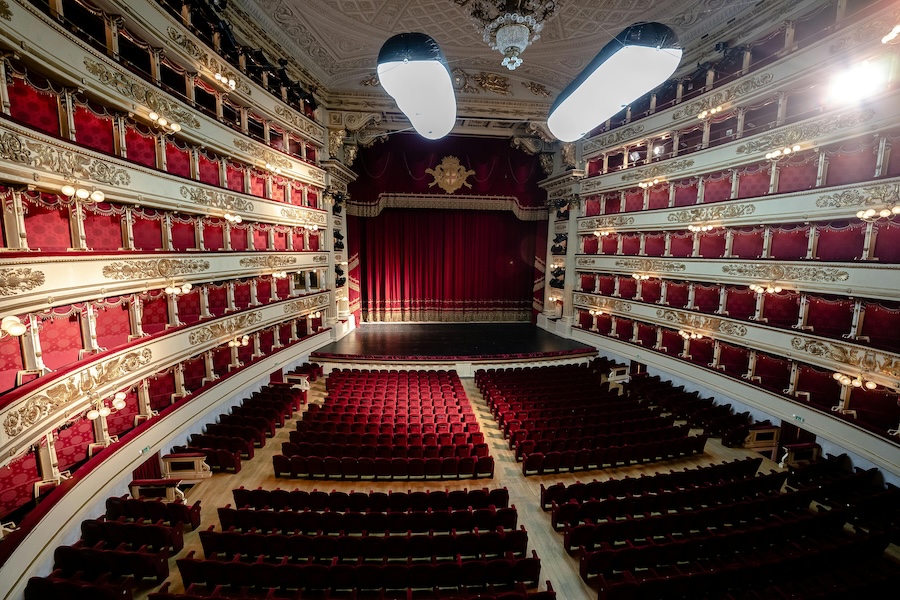 Red seats inside of an empty opera house, La Scala, in Milan