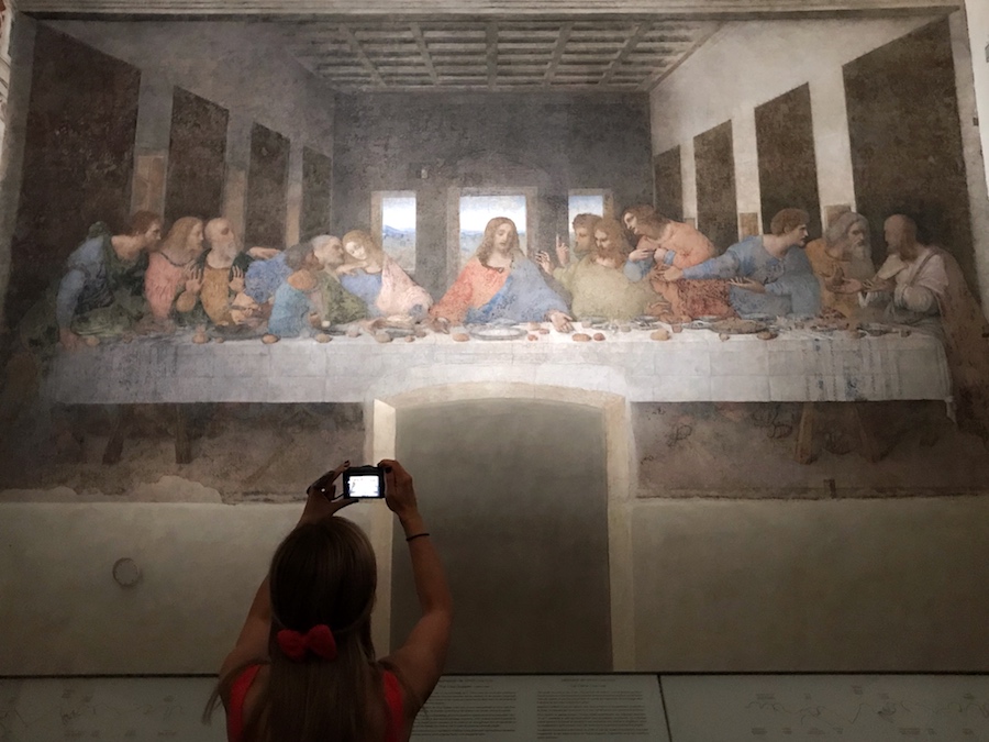 An image of the Last Supper by Leonardo da Vinci. Zuzi is taking a picture of the fresco