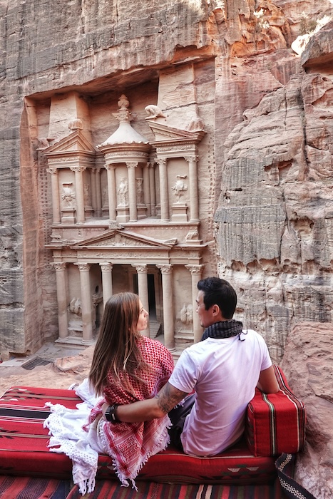 Jeff and Zuzi sit in front of the Treasury in Petra, Jordan