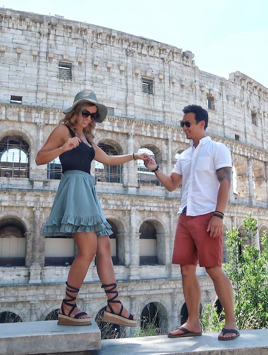 Jeff helps Zuzi down a step in front of the Colosseum in Rome