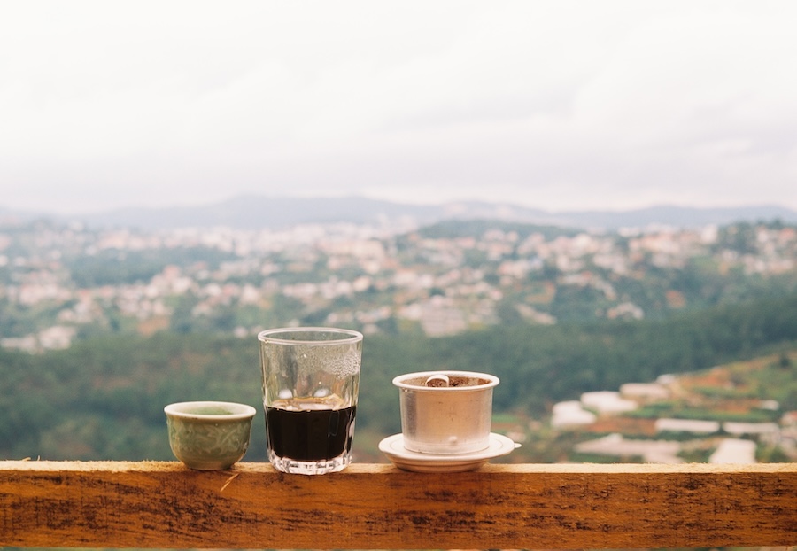 Vietnamese coffee with a view over hills and countryside