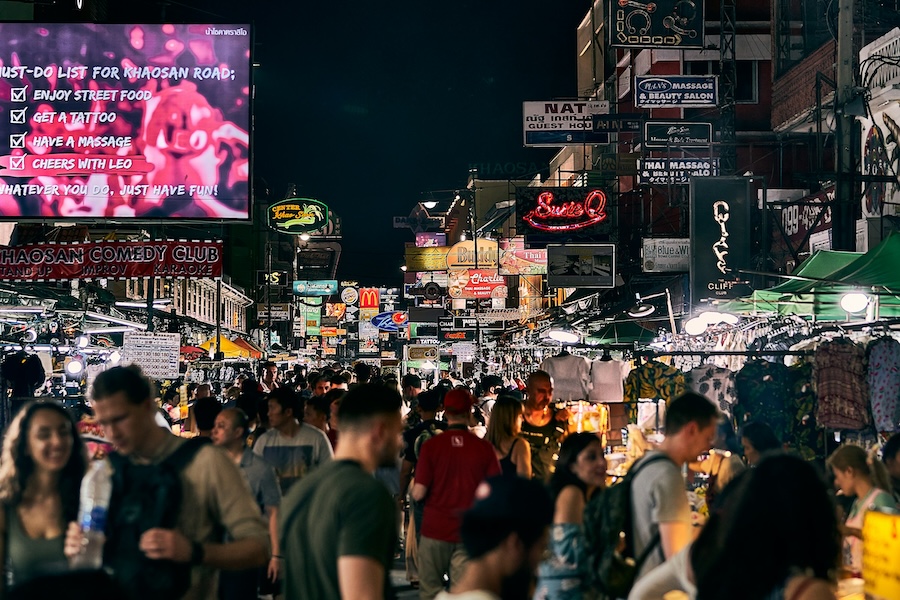 Crowds and street stalls along Khao San Road at night in Bangkok