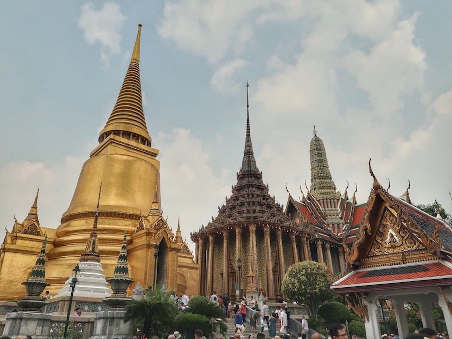 Golden stupa and temple buildings inside the Grand Palace complex in Bangkok
