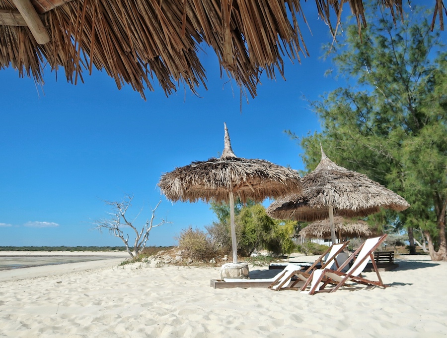 Beach umbrellas and empty coastline at Salary Bay in Madagascar