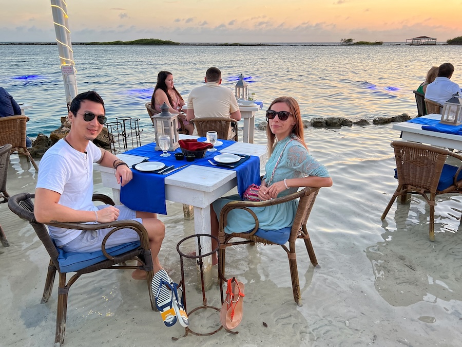 Sunset view from a water table at Flying Fishbone restaurant in Aruba
